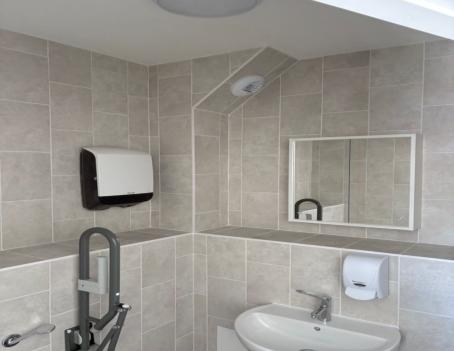 Suspended ceiling and LED lighting upgrade in a care home corridor